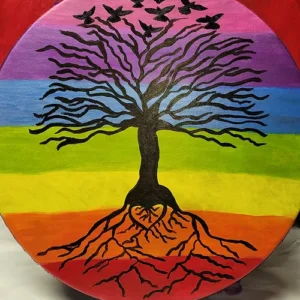 A painting of a tree with roots and the colors of the rainbow.