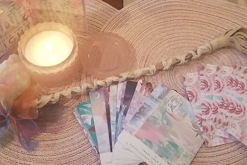 A candle and some cards on the table
